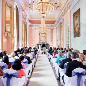 The marriage ceremony in full swing in the grand Versailles Room at Danesfield House 