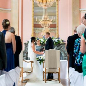 The civil wedding ceremony in progress in the Versailles Suite at Danesfield House 