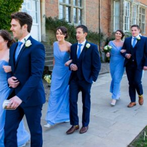 Dorton House wedding photography - the bridal party stroll through the grounds of the venue
