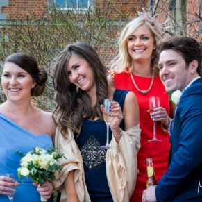 Candid wedding snap of some guests captured during the drinks reception at Dorton House 
