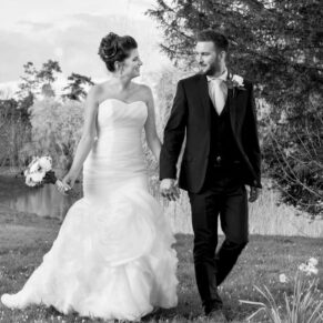 The newlyweds take a stroll in the grounds of their Buckinghamshire wedding reception at Dorton House 