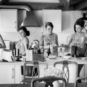 The ladies preparing drinks in the morning at a local cottage close by to the wedding venue Dorton House 