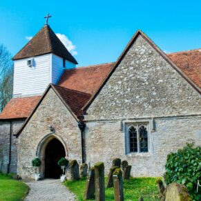 The chapel in the grounds of Dorton House under a perfect blue sky