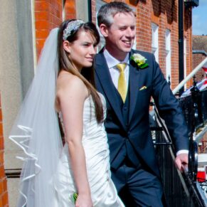 Harte and Garter wedding photography - the bride and groom enjoy the view from the balcony over Windsor Castle