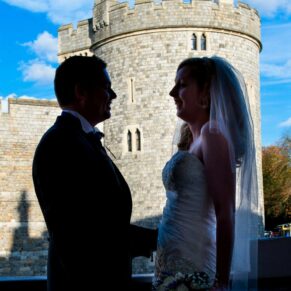 Harte and Garter wedding photography of the newlyweds in silhouette with Windsor Castle as the backdrop