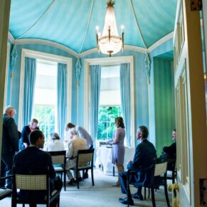 Hartwell House wedding photography - ceremony in progress in the Octagon Room