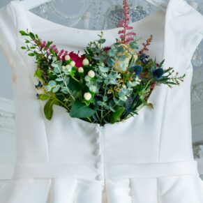 The delicate gown and the vibrant bouquet captured together