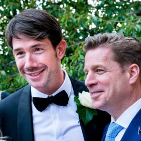 Two lads enjoying the party atmosphere during the drinks reception at Le Manoir Aux Quat Saisons 