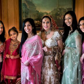 Asian bride gathered with her bridesmaids for a colourful and dramatic portrait at The Dairy