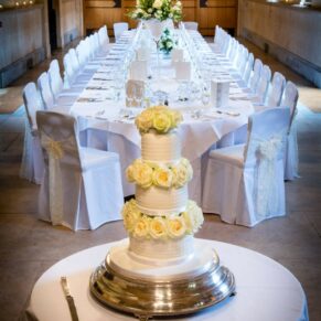 West Hall setup at The Dairy with the cake in the foreground and the fabulous banqueting table beyond