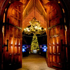 The Dairy captured through the main entrance doorway at Christmas with dramatic lighting in every direction
