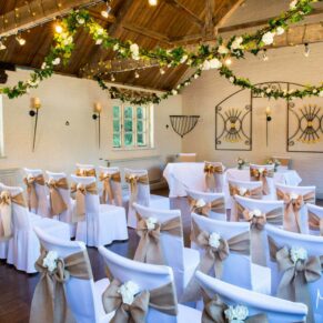 The stunning room setup for a civil ceremony in the stables at The Five Arrows in Waddesdon 