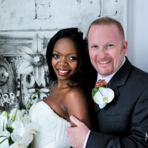 Portrait photography of the happy newlyweds lit through a big window in the White House at their summer Beaumont Estate wedding 