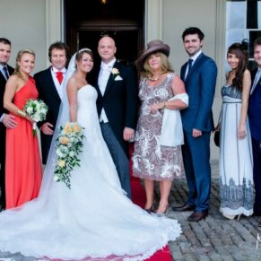 Wokefield Estate Berkshire Wedding Photography - group pose inside the portico whilst its raining