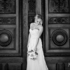 Bride in front of carved wooden doors at Waddesdon Manor wedding