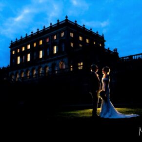 Cliveden House wedding photography - floodlit pose at dusk 
