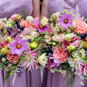 The colourful bridesmaids summer bouquets held close together