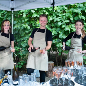 The busy bar staff pose for the camera in this relaxed capture