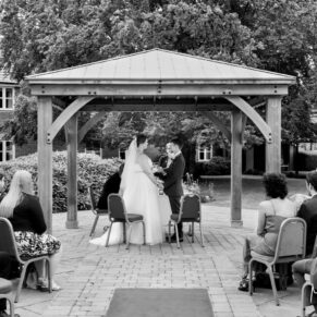 Courtyard ceremony in progress at this Mercure Lambert Hotel wedding, Thame