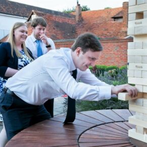 A few wedding guests playing jenga at The Mercure Lambert Hotel, Thame
