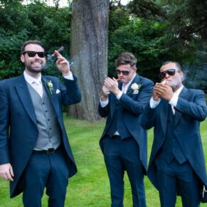 The lads take a cigar break captured at The Grange, Northwood wedding 