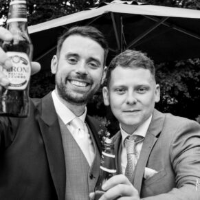 The groom and friend pose for the camera at The Grange, Northwood wedding 