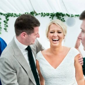 The bride and a friend enjoying the banter, captured at The Grange, Northwood 