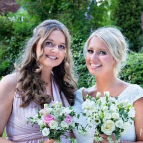 The bride with one of her bridesmaid’s captured at The Grange, Northwood wedding