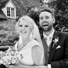 Black and white pose of the newlyweds captured at The Grange, Northwood wedding