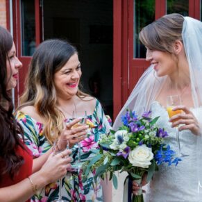 Five Arrows Hotel candid wedding photography of the bride and two girlfriends