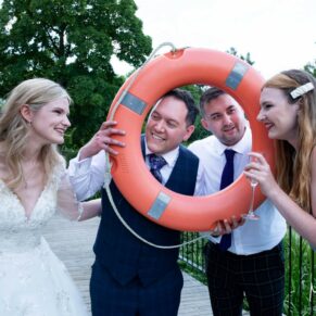 Swan at Streatley wedding - larking around for the group poses