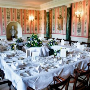 The atmospheric Doric Dining Room all setup for the wedding breakfast at Hartwell House 