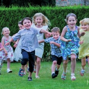 This fun capture of kids running and giggling out loud was taken in the Chilterns in lovely gardens