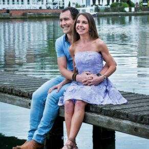 This waterside couple pose was captured by the River Thames in Marlow Buckinghamshire with the Compleat Angler in the distance during their engagement portraits photography session 