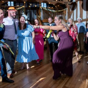 Some serious dance moves from one of the guest's on the dancefloor for this fun packed wedding at The Tudor Barn in Burnham