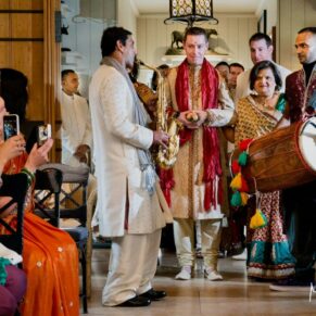 Buckinghamshire Asian Wedding Photography - entrance of the groom into the ceremony to great fanfare