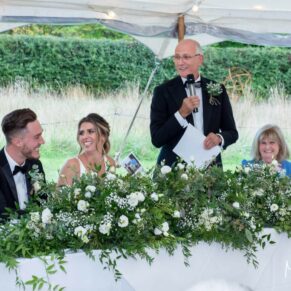 Dad's excellent speech in progress in the marquee being enjoyed by an enthusiastic top table