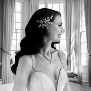 Black and white wedding photography bridal portrait pose captured pre ceremony in the bedroom at Hedsor House in Buckinghamshire 
