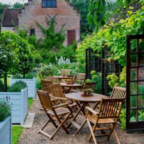 The gorgeous terrace surrounded by gorgeous wisteria foliage at Chenies Manor