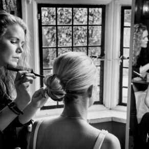 Time for some finishing touches prior to the ceremony for this bridesmaid at the Kings Chapel in Old Amersham 