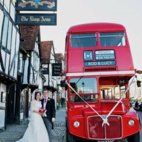 The newlyweds London red bus arrives at the High Street entrance to the Kings Chapel in Old Amersham 