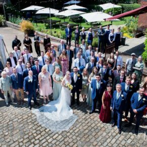 Buckinghamshire Marquee Wedding Photography - the group shot of everyone captured from high above at the Five Arrows Hotel