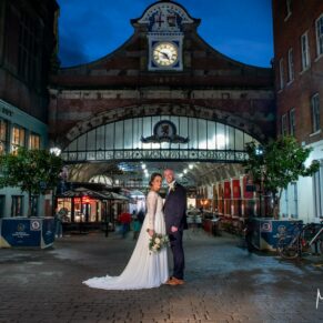 Buckinghamshire Winter Wedding Photography - the newlyweds captured outside the old railway station in central Windsor 