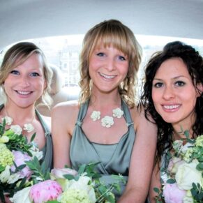 The smiling bridesmaids captured in the car before the marriage ceremony at in Marlow town centre