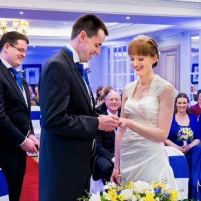The couple captured exchanging rings during their indoor civil ceremony in Marlow
