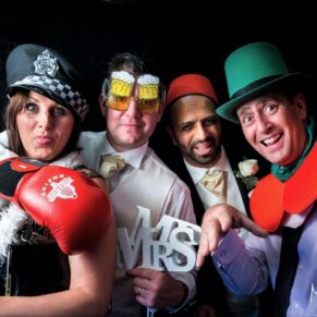 A photo-booth pose of some fun loving guests at this evening  wedding reception at Danesfield House Hotel 