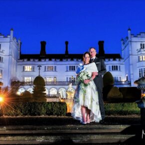 Dramatic night shot of the wedding newlyweds captured with my atmospheric floodlighting at the rear of Danesfield House Hotel 