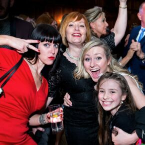 These ladies strike a fun pose on the dance floor at this lively Dorton House evening wedding reception 