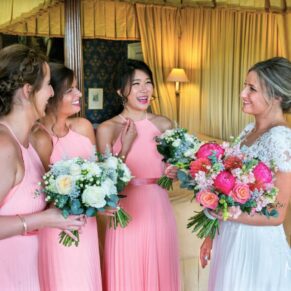 The bride with her bridesmaids captured informally in the bridal suite before the ceremony at this Hartwell House wedding 