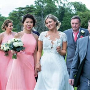 A casual photo captured on a walk about with the newlyweds and their bridal party at Hartwell House 